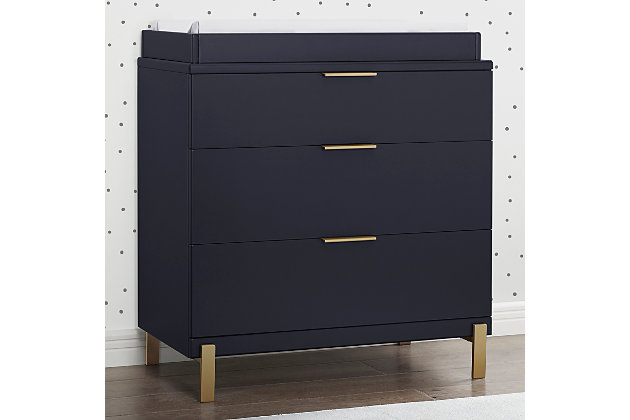 This fashionable and functional 3-drawer dresser with changing top offers and sturdy and stylish diaper changing station and plenty of storage space for your child's bedroom or nursery. With sleek bronze-tone feet and drawer pulls, the dresser’s contemporary design and neutral shades blend beautifully with almost any color scheme or room decor. When diaper-changing days are over, just remove the changing station and reclaim the space on top of the dresser. The versatile grow-with-me design ensures years of use in practically any room in your house.Includes 3-drawer dresser and changing top | Made of wood, engineered wood and metal | Dresser with bronze-tone legs and drawer pulls and 3 drawers for plenty of storage space | Durable, easy-to-clean black finish | UL Stability Verified; tested to ASTM F2057 Furniture Safety Standard; includes wall anchor | Changing station pairs with changing pads 32" L x 16" W x 1" D (sold separately) | JPMA certified; tested above and beyond industry standards | Assembly required
