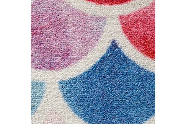 A sweet scalloped motif features watercolor inspired hues of pink, blue, teal and purple in the contemporary style of Mohawk Homes Mermaid Scales Area Rug. When it comes to color, the sky is no longer the limit with the infinite possibilities of Mohawk Homes revolutionary Prismatic Collection. Thoughtfully crafted in the U.S.A. in small batches utilizing Mohawk Homes exclusive Precision Dye Injected Printer, the Prismatic Collection is redefining printed rugs, literally one original design at a time. Designed on a plush EverStrand woven base, each style in this collection features superior strength stain resistance and a cozy soft touch. Consciously created with EverStrand yarn, Mohawk Homes exclusive premium recycled polyester produced from post-consumer plastic water bottles, this collection offers environmentally friendly options that are as easy on the eyes as they are the world around us.Kids/Tween Collection | Printed Area Rug | Made in the USA | 100% EverStrand
