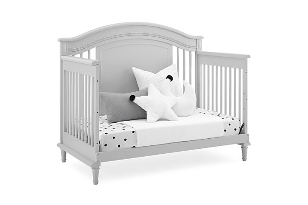 Elegant spindles, gorgeous molding and fluted legs with intricate carvings give the Juliette 6-in-1 Convertible Crib by Simmons Kids a sophisticated look. This crib’s grow-with-me design features three adjustable height levels that allow the crib to be lowered as your child grows, plus it converts from a crib, to a toddler bed, sofa, daybed, full size bed with headboard or full size bed with headboard and footboard. The only bed your little one will ever need, this versatile crib will take you from the nursery to high school, and all the years in between. Toddler Guardrail included; Full Size Bed Rails sold separately. To complete your nursery, pair with the coordinating Juliette 6 Drawer Dresser with Changing Top.  Producing the finest furniture for over 80 years, Simmons Kids has always been committed to the safety of every family. All Simmons Kids cribs are JPMA certified, are rigorously tested to meet or exceed all industry safety standards.Safe option for your baby: this crib is jpma certified to meet or exceed all safety standards set by the cpsc & astm; we know chemicals have no place in your nursery, so we use a non-toxic multi-step painting process that is lead and phthalate safe | 6-in-1 convertible crib: crib converts to toddler bed, daybed, sofa, a full size bed with headboard and footboard and full size bed with headboard only; daybed/sofa/toddler guardrail kit included (full size wood bed rails #0050 or full size metal bed frame #0040 sold separately); available in moonstruck grey or bianca white | Adjustable height: adjustable height mattress support with 3 convenient positions to grow with your baby | Coordinating items: pair with the juliette 6 drawer dresser with changing top for the perfect baby nursery; uses a standard size crib mattress (sold separately); to ensure the perfect fit pair your crib with a delta children, serta, beautyrest or simmons kids crib mattress | Quality material: made of sustainable woods like new zealand pine wood, poplar wood and tsca compliant engineered wood; tested for lead and other toxic elements to meet or exceed government and astm safety standards | Size: assembled dimensions: 56.75"w x 32.25"d x 46"h; easy assembly