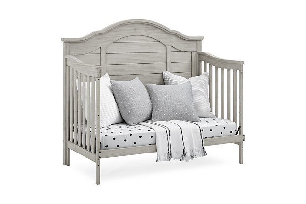 The elegant curves and shiplap-inspired headboard of the Asher 6-in-1 Convertible Baby Crib by Simmons Kids are brought to life with a lightly textured finish. A great option for your baby's nursery, this convertible crib features a dramatic silhouette that will make it the focal point of any bedroom for years to come. Its grow-with-me design features three adjustable height levels that allow the crib to be lowered as your child grows, plus it converts from a crib, to a toddler bed, sofa, daybed, size bed with headboard or size bed with headboard and footboard. The only bed your little one will ever need, this versatile crib will take you from the nursery to high school, and all the years in between. Toddler Guardrail included; Size Bed Rails sold separately. Given the hand applied nature of this baby crib’s finish, variations in the wood are to be expected and celebrated. Producing the finest furniture for over 80 years, Simmons Kids has always been committed to the safety of every family. All Simmons Kids cribs are JPMA certified, are rigorously tested to meet or exceed all industry safety standards.Safe option for your baby: this crib is jpma certified to meet or exceed all safety standards set by the cpsc & astm; we know chemicals have no place in your nursery, so we use a non-toxic multi-step painting process that is lead and phthalate safe | 6-in-1 convertible crib: crib converts to toddler bed, daybed, sofa, a size bed with headboard and footboard and size bed with headboard only; daybed/sofa/toddler guardrail kit included ( size wood bed rails #330750 or size metal bed frame #0040 sold separately); available in rustic mist or rustic grey. Crib features a softy textured finish that’s hand applied | Adjustable height: adjustable height mattress support with 3 convenient positions to grow with your baby | Coordinating items: pair with the asher 6 drawer dresser with changing top for the perfect baby nursery, uses a standard size crib mattress (sold separately) to ensure the perfect fit pair your crib with a delta children, serta, beautyrest or simmons kids crib mattress | Quality material: made of sustainable woods like new zealand pine and tsca compliant engineered wood tested for lead and other toxic elements to meet or exceed government and astm safety standards | Size: assembled dimensions: 56.75"w x 31"d x 49.5"h, easy assembly
