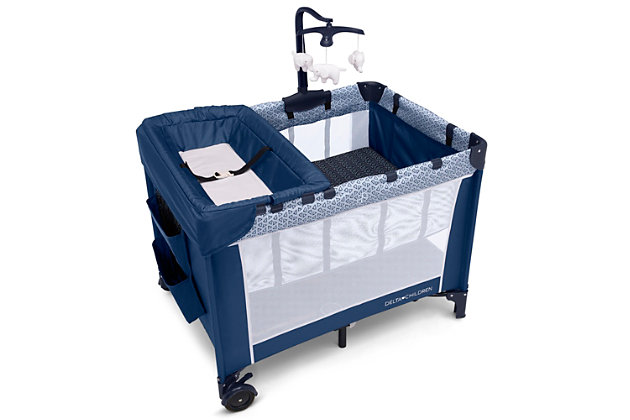 Keep your baby safe, close and comfy with the LX Deluxe Play Yard from Delta Children. You'll love all the convenient features-the removable bassinet provides the ideal spot for naptime or bedtime, and the removable changing table means you'll always have a sturdy place to change diapers or dress your baby. The detachable storage compartment keeps changing necessities nearby, so you never have to run to another room for diapers or wipes. When your baby outgrows the bassinet, the insert is removable and the LX Deluxe Play Yard functions like a full size playard. Large mesh sides provide optimal ventilation while also permitting a clear view. Designed to use at home or away, the play yard's wheels make it super-easy to move around the house, and the quick fold construction and included carry bag make for fuss-free travel. The LX Deluxe Play Yard from Delta Children features everything needed for a nursery in a portable design. Delta Children was founded around the idea of making safe, high-quality children's furniture affordable for all families. They know there's nothing more important than safety when it comes your child's space. That's why all Delta Children products are built with long-lasing materials to ensure they stand up to years of jumping and playing. Plus, they are rigorously tested to meet or exceed all industry safety standards.RECOMMENDED USE: Deluxe Play Yard features a removable full size bassinet and changing table; Bassinet holds up to 15 pounds; Changing Table holds up to 25 pounds; Play Yard holds children up to 35 Inches tall | FUN FOR BABY, EASY FOR YOU: Removable mobile arm with hanging plush toys engages early visual development; Removable changing table station features waterproof surface; Snap on hanging storage compartment for diapers, wipes and other toiletries | TRAVEL FRIENDLY: Quick and compact fold; Includes carrying bag for fuss free travel or storage; Easy to pack; Great mini crib alternative; Two wheels allow for easy movement from room to room; Easy to assemble; no tools required | SIZE: Assembled dimensions: 27.75"L x 37.4"W x 40.2"H  | YOUR BABY’S SAFETY IS OUR FIRST PRIORITY: JPMA certified to meet or exceed all safety standards set by the CPSC and ASTM