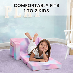 The Cozee Flip Out Chair - 2-in-1 Convertible Chair to Lounger by Delta Children is a cozy chair by day, laid-back lounger by night. This convertible seat easily flips open to reveal multiple ways for your child to relax--they’ll love to sit and read or watch their favorite movies on the chair but when it’s time for a nap, this seat folds out into a comfy sleeper bed. Big enough to fit two small kids comfortably in chair mode, it’s light enough to move around the house and is ideal for your children to share during playtime or sleepovers. The super-soft slipcover with easy-to-reach side pocket is treated with a Scotchgard stain release finish to resist stains, ensuring the chair looks beautiful for years to come! The supportive foam construction will keep its shape and provides all-day comfort. Designed to ship in a super-small box, this lightweight foam kids’ chair and lounger may take up to 24 hours to fully expand once unboxed. Machine-washable slipcover zips off for easy cleaning. Recommended for ages 18 months+. Delta Children was founded around the idea of making safe, high-quality children's furniture affordable for all families. They know there's nothing more important than safety when it comes to your child's space. That's why all Delta Children products are built with long-lasting materials to ensure they stand up to years of jumping and playing. Plus, they are rigorously tested to meet or exceed all industry safety standards.Convertible 2-in-1 design: this flip-open chair converts to a lounger/sleeper; ideal for reading, relaxing, playing or sleeping, your child will enjoy this chair with siblings/friends; recommended for ages 18 months+; fits 1 to 2 small children | Comfy foam construction: supportive foam keeps its shape and provides all-day comfort; soft and durable slipcover features side pocket to keep books/tablet within reach; lightweight chair is portable, great for bedrooms, playrooms, gaming or studying | Stain-resistant: keep chair looking new with the built-in scotchgard stain release finish that helps most stains wash out during normal laundering; chair features a machine-washable slipcover that zips off | Child-safe zipper: to prevent kids from opening the chair, we use a childproof safety zipper that comes without a pull, it can only be opened using a paperclip; chair meets or exceeds government and astm safety standards | Easy to unbox: ships in a super-small box; assembly required; once unboxed chair expands 5x (may take 24 hours to fully expand); chair: 23.5”w x 16.5”d x 15”h; lounger flipped open: 23.5”w x 40.5”d x 15”h