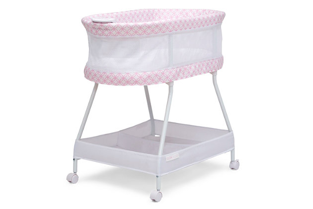 Keep your newborn safely nearby with the Sweet Dreams Bassinet by Delta Children. Designed to help baby and parents sleep better, it features breathable mesh sides for air flow and visibility, as well as an electronic pod that has vibration, music, nature sounds and nightlight. A dream come true for new parents, this bedside sleeper includes a machine washable bassinet sheet, large storage basket that keeps essentials close and wheels that make it easy to move. The modern pattern ensures this bassinet flawlessly coordinates with any décor. This bassinet is recommended for babies 0-5 months. Max weight 30 lbs. Stop use at 5 months or once your infant begins to push up on their hands and knees, whichever comes first.   Delta Children was founded around the idea of making safe, high-quality children's furniture affordable for all families. They know there's nothing more important than safety when it comes to your child's space. That's why all Delta Children products are built with long-lasting materials to ensure they stand up to years of jumping and playing. Plus, they are rigorously tested to meet or exceed all industry safety standards.Vibration & sounds: this bassinet’s electronic pod features music, nature sounds, nightlight and vibrations | Airflow mesh: breathable mesh on sides promote airflow and provide visibility; bassinet includes 1-inch waterproof mattress pad and fitted sheet; sheet is machine washable | Tons of storage: large storage basket under the frame keeps baby's necessities within reach; size: assembled dimensions: 32"l x 20"w x 30.5"h | Easy moveability: 4 locking wheels for easy movability from room to room | We put your baby's safety first: jpma certified to meet or exceed all safety standards set by the cpsc and astm; requires 4 aa batteries (sold separately)