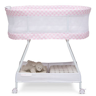 Keep your newborn safely nearby with the Sweet Dreams Bassinet by Delta Children. Designed to help baby and parents sleep better, it features breathable mesh sides for air flow and visibility, as well as an electronic pod that has vibration, music, nature sounds and nightlight. A dream come true for new parents, this bedside sleeper includes a machine washable bassinet sheet, large storage basket that keeps essentials close and wheels that make it easy to move. The modern pattern ensures this bassinet flawlessly coordinates with any décor. This bassinet is recommended for babies 0-5 months. Max weight 30 lbs. Stop use at 5 months or once your infant begins to push up on their hands and knees, whichever comes first.   Delta Children was founded around the idea of making safe, high-quality children's furniture affordable for all families. They know there's nothing more important than safety when it comes to your child's space. That's why all Delta Children products are built with long-lasting materials to ensure they stand up to years of jumping and playing. Plus, they are rigorously tested to meet or exceed all industry safety standards.Vibration & sounds: this bassinet’s electronic pod features music, nature sounds, nightlight and vibrations | Airflow mesh: breathable mesh on sides promote airflow and provide visibility; bassinet includes 1-inch waterproof mattress pad and fitted sheet; sheet is machine washable | Tons of storage: large storage basket under the frame keeps baby's necessities within reach; size: assembled dimensions: 32"l x 20"w x 30.5"h | Easy moveability: 4 locking wheels for easy movability from room to room | We put your baby's safety first: jpma certified to meet or exceed all safety standards set by the cpsc and astm; requires 4 aa batteries (sold separately)
