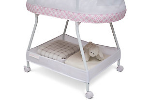 Keep your newborn safely nearby with the Sweet Dreams Bassinet by Delta Children. Designed to help baby and parents sleep better, it features breathable mesh sides for air flow and visibility, as well as an electronic pod that has vibration, music, nature sounds and nightlight. A dream come true for new parents, this bedside sleeper includes a machine washable bassinet sheet, storage basket that keeps essentials close and wheels that make it easy to move. The modern pattern ensures this bassinet flawlessly coordinates with any décor. This bassinet is recommended for babies 0-5 months. Max weight 30 lbs. Stop use at 5 months or once your infant begins to push up on their hands and knees, whichever comes first. Delta Children was founded around the idea of ma safe, high-quality children's furniture affordable for all families. They know there's nothing more important than safety when it comes to your child's space. That's why all Delta Children products are built with long-lasting materials to ensure they stand up to years of jumping and playing. Plus, they are rigorously tested to meet or exceed all industry safety standards.Vibration & sounds: this bassinet’s electronic pod features music, nature sounds, nightlight and vibrations | Airflow mesh: breathable mesh on sides promote airflow and provide visibility; bassinet includes 1-inch waterproof mattress pad and fitted sheet; sheet is machine washable | Tons of storage: storage basket under the frame keeps baby's necessities within reach; size: assembled dimensions: 32"l x 20"w x 30.5"h | Easy moveability: 4 loc wheels for easy movability from room to room | We put your baby's safety first: jpma certified to meet or exceed all safety standards set by the cpsc and astm; requires 4 aa batteries (sold separately)