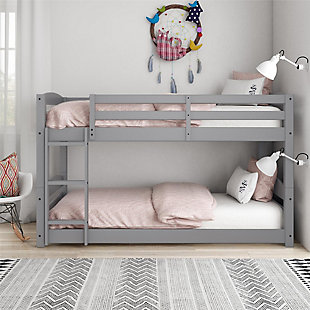 Sleep in style with the customizable, space-saving design of the Atwater Living Aaida Bunk Bed. The increased sleeping capacity is common sense for cottages, extended family, out of town guests or hosting your child’s rambunctious friends for a sleepover. The Aaida features a gray finish, clean lines and horizontal slats with a built-in stepladder to access the top bunk. Each bed features its own personal space with easy dependable access in and out. The ultimate space saver, the Aaida’s multiple configurations also allow it to be set up as a traditional bunk bed or simply two separate twin beds. The unique floor bunk bed design will allow you to maximize your space while the sturdy, solid construction adds both durability and functionality. Fun, safe and stylish, the Atwater Living Aaida Twin Bunk Bed is the perfect antidote for sleeping multiple people in smaller spaces.Made of wood and engineered wood | Transitional twin size bunk bed made with a solid wood construction. | Easily converts into two separate twin size beds. Each bed is designed to accommodate a standard twin size mattress (sold separately). Bed slats included and no box spring required. | Small space living approved. Promises optimal support and durability with sturdy integrated ladder and slats. | 1 Year limited warranty | Asssembly required
