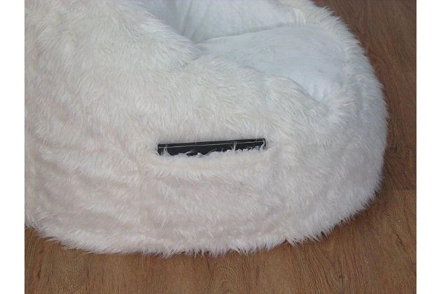 This Structured Tablet Fur Bean Bag the softest seat in the house. Our superior-quality faux fur is as luxurious as it is beautiful. It is a perfect addition to your children's room or teen study area, equipped with a sewn in side pocket to hold your Tablet or favorite book.Soft faux fur cover made from 80% polyester and 20% acrylic. | Filled with 100% polystyrene beads | Built-in tablet pocker on the side. | Handle for easy moving.