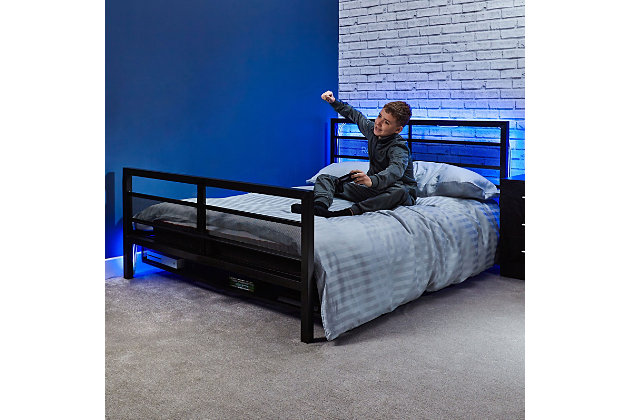 Upgrade your gaming setup with the X Rocker Basecamp Gaming Bed. This full size bed features a sleek black design with contrasting X Rocker branding for a modern look. The under-bed storage cavity with a metal mesh frame allows air flow and prevents consoles from overheating. With a sturdy metal frame and slats, this bed is designed with long-lasting durability in mind. With its mix of comfort and technology, this bed gives the dedicated gamer the ultimate gaming experience they deserve. Measuring 77.64" x 56.3" x 36.22" with a weight capacity of 220 lbs, this bed is the perfect size for gaming and relaxing at the end of the day. This version does not have a TV mount.GAMING BED: Upgrade your setup for the ultimate gaming experience with this full size bed's sleek black design with contrasting X Rocker branding | MODERN DESIGN: Bed features a sleek design and mix of comfort and technology for a modern look | UNDER-BED STORAGE: Under-bed storage cavity with a metal mesh frame allows air flow and prevents consoles from overheating | DURABLE: Sturdy metal frame and slats guarantee long-lasting durability | FULL SIZE: Measuring 77.64" x 56.3" x 36.22" with a weight capacity of 220 lbs, this full bed is the perfect size for gaming and relaxing at the end of the day