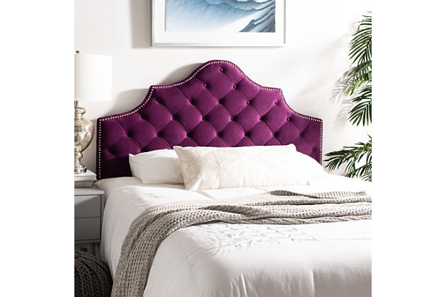Furnishings in the hotel suite that's a second home to the residents of Buckingham Palace inspired this tufted velvet headboard. Designed for the boudoir of a modern princess, its upholstery is adorned with polished nailhead detail.Made with wood | Upholstered in aubergine tufted polyester over padding | Nailhead trim with polished silvertone finish | Headboard only | Assembly required