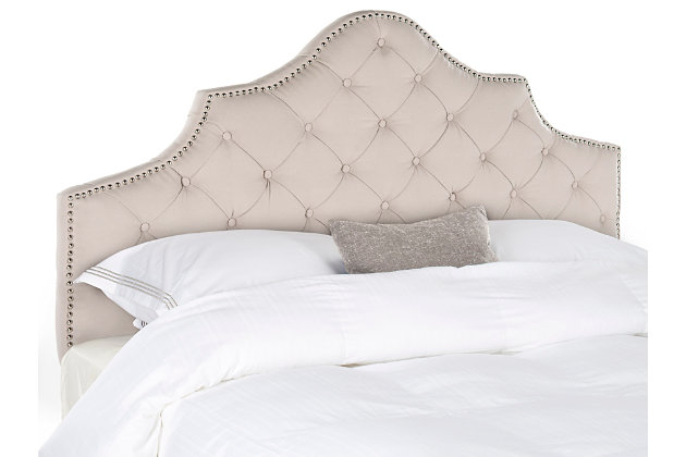 Lavish upholstery and expert tailoring create the aura of European elegance in the Arebelle tufted headboard. The classic camelback silhouette is outlined with nailhead trim accenting richly button-tufted natural linen.Made with wood | Upholstered in taupe tufted linen over padding | Nailhead trim with silvertone finish | Headboard only | Assembly required