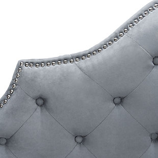 In the heart of Paris’ Marais district is the boutique hotel whose interiors inspired the graceful curves and sumptuous upholstery of this tufted headboard. Detailed with striking nailhead trim, its deluxe style makes the boudoir a five-star stay.Made with wood | Upholstered in gray tufted polyester over padding | Nailhead trim with polished silvertone finish | Headboard only | Assembly required