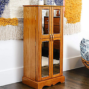 Behind every attractive woman is a little bit of mystery. (Like, how in the world does she organize all her accessories?!) The Chelsea Jewelry Armoire can be your little secret to achieving that enigma. The mirrored doors and inside vanity mirror combined with the abundance of storage space makes getting ready a cinch. The walnut finish, French doors, and polished hardware give this storage solution an alluring appeal. Its organizational abilities are pretty straightforward—handy divided compartments on top and inside each of the seven drawers and 16 necklace hooks on each side. The anti-tarnish felt lining ensures your prized possessions are kept preserved and pristine. Take the stress out of looking your best with this jewelry storage armoire.Made with wood | Top lid opens to reveal a vanity mirror and cord management hole | Both front mirrored doors open to display 8 necklace hooks on each | 7 drawers | Interior is lined with plush felt | Assembly required