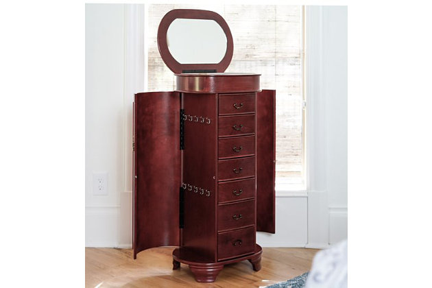 Hives & Honey’s Daley Oval Standing Jewelry Armoire is a one-of-a-kind piece! Designed with tradition in mind, this stylish armoire also has a modern touch with the rounded edges. The Daley Jewelry Armoire will store your entire jewelry collection with ease; all drawers are lined with an anti-tarnish felt. Available in three colors: cherry, black, & turquoise. Item Dimensions: 38 H x 16 W x 12.5 DMade with wood | Fully lined with anti-tarnish felt | 7 pull out drawers with various storage configurations | 2 side panels open with necklace hooks in each | Assembly required