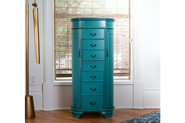Hives & Honey’s Daley Oval Standing Jewelry Armoire is a one-of-a-kind piece! Designed with tradition in mind, this stylish armoire also has a modern touch with the rounded edges. The Daley Jewelry Armoire will store your entire jewelry collection with ease; all drawers are lined with an anti-tarnish felt. Available in three colors: cherry, black, & turquoise. Item Dimensions: 38 H x 16 W x 12.5 DMade with wood | Fully lined with anti-tarnish felt | 7 pull out drawers with various storage configurations | 2 side panels open with necklace hooks in each | Assembly required
