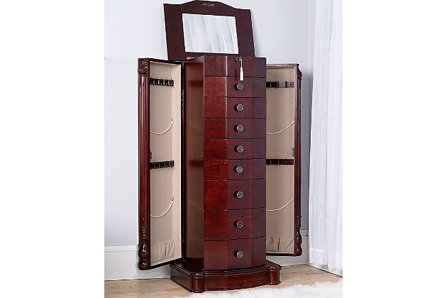 The Florence Jewelry Armoire is a Hives & Honey statement piece. Standing almost 40 inches tall with 8 pull out drawers, 3 drawers with divided compartments, all lined with anti-tarnish felt, ring rolls and two side panel doors with 10 necklace hooks in each– the Florence is sure to store your entire jewelry collection. Not to mention, the top has locking functionality that opens to reveal a vanity mirror and a cord management hole, so you can get ready and listen to your playlist before going out. Complete with the rich finish, applied by the hands of artisans in a multiple step process, this armoire looks and feels like an expensive family heirloom.Made with wood | 8 drawers fully lined with anti-tarnish felt | Doors open on both sides to display necklaces hook; each features 10 hooks on two tiers | Top locking functionality | Assembly required