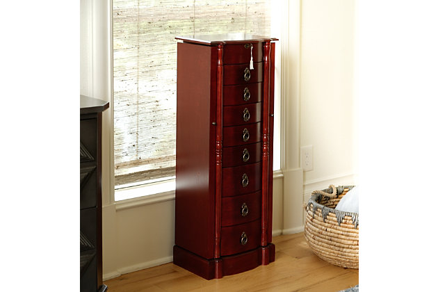 We know it’s hard to pass up that shiny new bauble, that perfect piece of eye candy, that sparkly little pretty gem. With the Robyn Jewelry Armoire, you’ll never have to deny another piece of jewelry again. Even the most extensive jewelry collection will feel right at home inside this storage armoire with the locking lid and side and drawer storage compartments. Use it to store your necklaces, earrings, rings, bracelets and anything else you want to keep safe and sound and in pristine condition. The top opens to reveal a vanity mirror, so you can get ready and take one last look before going out. The curved front, streamlined design, and stunning bronze hardware is reminiscent of Dutch design. The rich, antiqued walnut finish makes this armoire feel like an expensive family heirloom.Made of solid wood, engineered wood and solid veneer | Lined with anti-tarnish felt | Top locking functionality | Bronze-tone hardware | 9 storage drawers | Assembly required