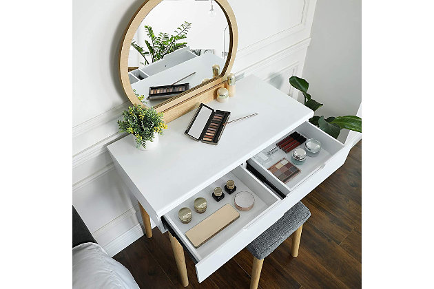 This vanity set covers provides just what you need to get ready. Two sliding, deep drawers keep makeup supplies and hairbrushes at your fingertips, and a spacious tabletop leaves you a large space for the items in your beauty routine.Includes vanity table and upholstered stool | Made of wood and metal | 2 drawers | Rounded mirror | Spacious top | Assembly required