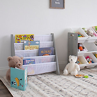 The space-saving, toddler-sized Humble Crew Kids Bookshelf 4 Tier Book Organizer is the perfect storage solution for your little one's favorite collection of books. Our bookcase displays books with covers facing forward, making identification and retrieval easy for children. This bookrack features a beautiful grey wood finish and four deep fabric storage pockets in white for reading books, board books, coloring books and magazines of all shapes and sizes. This space-saving bookshelf is sized just right for your toddler and is ideal for children aged 3 and up.  Made with sturdy engineered wood construction, it is easy to assemble and clean. All hardware is included. Assembled dimensions: 25" W x 11" D x 24" HToddler-sized kid's bookshelf displays books with covers facing forward for easy identification. | Four deep fabric storage pockets stow reading books, board books, coloring books and magazines of all shapes and sizes | Sturdy engineered wood construction is easy to assemble and clean.  includes all hardware. | Ideal for children aged 3 and up | Space-saving design. Assembled dimensions: 25"w x 11"d x 24"h | Neutral compact design fits into any room or environment.
