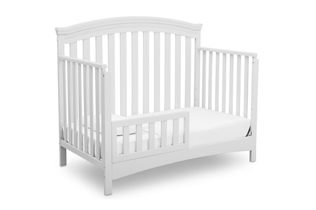 You'll love the Emerson 4-in-1 Convertible Crib from Delta Children for its classic design and subtle traditional details that work with any décor. Featuring an arched silhouette with airy slats around all sides and bead detailing on the headboard and footboard, this stylish crib will help you create a restful and beautiful nursery. Designed to grow along side your child, this strong and sturdy crib has three mattress height positions that allow you to lower the crib as your little one matures, plus it converts into a toddler bed, daybed and full size bed (Toddler Guardrail and Full Size Bed Rails sold separately). Epitomizing timeless style, the Emerson 4-in-1 Convertible Crib will be the centerpiece of your child's space at any age. To complete the look, pair with the coordinating Emerson 3 Drawer Dresser with Changing Top (sold separately).CONVERTIBLE CRIB: Converts from a crib to a toddler bed, daybed and full size bed with headboard and footboard (Daybed Rail included) | GROWS WITH BABY: The 3-position mattress height adjustment on this crib allows you to lower the mattress as your baby begins to sit or stand | BUILT TO LAST: Strong and sturdy wood construction helps create a dream nursery where you'll spend plenty of Mommy and Me/Daddy and Me time. Easy assembly | WE PUT YOUR BABY'S SAFETY FIRST: This crib is JPMA certified to meet or exceed all safety standards set by the CPSC and ASTM. Tested for lead and other toxic elements to meet or exceed government and ASTM safety standards | SIZE: 55"W x 30.25"D x 45.25"H. Fits standard size crib mattress (sold separately)