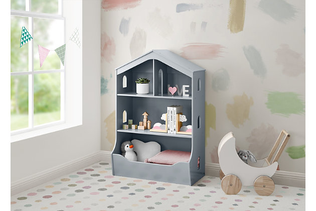 Keep your little one's bedroom or playroom organized with the Dollhouse Bookcase with Toy Storage by Delta Children. This adorable bookcase houses two shelves and a roomy toy bin on the bottom that makes it great not just for books, but for toys, too. Cutout windows and a cool passthrough on the top shelf of this bookcase inspires imaginative play and doubles as modern space for your child's dolls. Available in gray, Bianca White and Mint. Delta Children was founded around the idea of making safe, high-quality children's furniture affordable for all families. They know there's nothing more important than safety when it comes to your child's space. That's why all Delta Children products are built with long-lasting materials to ensure they stand up to years of jumping and playing. Plus, they are rigorously tested to meet or exceed all industry safety standards.VERSATILE: This bookcase features two shelves and a roomy toy bin on the bottom. Can be used in any room in the house | SAFE OPTION: We know chemicals have no place in your house, so we use a non-toxic multi-step painting process that is lead and phthalate safe. This bookcase includes a tipover restraint (safety anchor) for you to securely attach it to your wall. Engineered and tested for safety | COORDINATING ITEMS: Pair this bookcase with any Delta Children item in the same finish | QUALITY MATERIAL: Made of sustainable woods like New Zealand Pine and TSCA compliant engineered wood. Tested for lead and other toxic elements to meet or exceed government and ASTM safety standards.Durable and easy to clean finish; wipe with damp cloth and dry immediately | SIZE: Assembled dimensions: 28.55"W x 15.25"D x 42.25"H . Two top shelves: 27"W x 11.75"D. Bottom shelf: 27"W x 13.25"D with 11.75" between shelves. Easy assembly