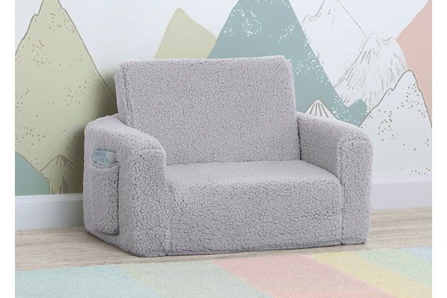 The Cozee Flip-Out Sherpa 2-in-1 Convertible Chair to Lounger by Delta Children is a cozy chair by day, laid-back lounger by night. This convertible seat easily flips open to reveal multiple ways for your child to relax--they'll love to sit and read or watch their favorite movies on the chair but when it's time for a nap, this seat folds out into a comfy sleeper bed. Big enough to fit two small kids comfortably in chair mode, it's light enough to move around the house and is ideal for your children to share during playtime or sleepovers. The super-soft Sherpa slipcover with easy-to-reach side pocket creates the ultimate retreat for your little one. The supportive foam construction will keep its shape and provides all-day comfort. Designed to ship in a super-small box, this lightweight foam kids' chair and lounger may take up to 24 hours to fully expand once unboxed. Machine-washable slipcover zips off for easy cleaning. Recommended for ages 18 months+. Delta Children was founded around the idea of making safe, high-quality children's furniture affordable for all families. They know there's nothing more important than safety when it comes to your child's space. That's why all Delta Children products are built with long-lasting materials to ensure they stand up to years of jumping and playing. Plus, they are rigorously tested to meet or exceed all industry safety standards.CONVERTIBLE 2-IN-1 DESIGN: This flip-open chair converts to a lounger/sleeper. Ideal for reading, relaxing, playing or sleeping, your child will enjoy this chair with siblings/friends. Recommended for ages 18 months+. Fits 1 to 2 small kids | COMFY FOAM CONSTRUCTION: Supportive foam keeps its shape and provides all-day comfort. Soft and durable slipcover features side pocket to keep books/tablet within reach. Lightweight chair is portable, great for bedrooms, playrooms, gaming or studying | SUPER-COZY SHERPA: This flip open chair features a super-soft Sherpa slipcover that adds texture and comfort. Chair features a machine-washable slipcover that zips off | CHILD-SAFE ZIPPER: To prevent kids from opening the chair, we use a childproof safety zipper that comes without a pull, it can only be opened using a paperclip. Chair meets or exceeds government and ASTM safety standards | EASY TO UNBOX: Ships in a super-small box. Assembly required. Once unboxed chair expands 5x (may take 24 hours to fully expand). Chair: 23.5"W x 16.5"D x 15"H. Lounger Flipped Open: 23.5"W x 40.5"D x 15"H