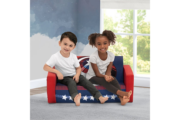 The Marvel Avengers Cozee Flip-Out Sofa by Delta Children is a cozy sofa by day, laid-back lounger by night. This convertible seat easily flips open for multiple ways for your child to relax--they'll love to sit and read or watch their favorite movies on the sofa but when it's time for a nap, this seat folds out into a comfy sleeper bed. Plus, when the chair is flipped open it magically reveals Captain America with his shield. Big enough to 2 to 3 small kids comfortably in sofa mode, it's light enough to move around the house and is ideal for your children to share during playtime or sleepovers. The super-soft slipcover with easy-to-reach side pocket is treated with a Scotchgard stain release finish to resist stains, ensuring the chair looks beautiful for years to come! The supportive foam construction will keep its shape and provides all-day comfort. Designed to ship in a super-small box, this lightweight foam kids' sofa and lounger may take up to 24 hours to fully expand once unboxed. Machine-washable slipcover zips off for easy cleaning. Recommended for ages 18 months+. About Avengers: Earth's Mightiest Heroes joined forces to take on threats that were too big for any one hero to tackle. With a roster that has included Captain America, Iron Man, Ant-Man, Hulk, Thor, Wasp and dozens more over the years, the Avengers have come to be regarded as Earth's No. 1 team. Create your own epic Marvel adventures with kids' furniture from Delta Children.CONVERTIBLE 2-IN-1 DESIGN: This flip-open sofa converts to a lounger/sleeper. Ideal for reading, relaxing, playing or sleeping, your child will enjoy this sofa with siblings/friends. Recommended for ages 18 months+. Fits 2 to 3 small kids | COMFY FOAM CONSTRUCTION: Supportive foam keeps its shape and provides all-day comfort. Soft and durable slipcover features side pocket to keep books/tablet within reach. Lightweight sofa is portable, great for bedrooms, playrooms, gaming or studying | STAIN-RESISTANT: Keep sofa looking new with the built-in Scotchgard stain release finish that helps most stains wash out during normal laundering. Sofa features a machine-washable slipcover that zips off | CHILD-SAFE ZIPPER: To prevent kids from opening the sofa, we use a childproof safety zipper that comes without a pull, it can only be opened using a paperclip. Sofa meets or exceeds government and ASTM safety standards | EASY TO UNBOX: Sofa in a super-small box. Assembly required. Once unboxed sofa expands 5x (may take 24 hours to fully expand). Sofa: 30"W x 16.5"D x 15"H. Lounger Flipped Open: 30"W x 40.5"D x 15"H