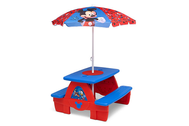 Be prepared for backyard barbecues and playdates with the Disney Mickey Mouse 4 Seat Activity Picnic Table with Umbrella and Lego Compatible Tabletop by Delta Children. Made from weather-resistant plastic, this durable picnic table sits four kids comfortably, and can be used outdoors or indoors for eating, playing, art activities or games--there are so many ways to use this sturdy picnic table! Colorful graphics of Mickey Mouse add playful style and the included umbrella provides much needed shade on sunny days while four built-in cupholders keep drinks securely in place. Designed to boast and encourage your child's imagination the table also features a removable building block board that is compatible with LEGO blocks (LEGO blocks not included). Easy to assemble, the table snaps together in minutes, so you'll be ready for fun in no time! About Mickey Mouse: Mickey, the world's most famous Mouse, has been delighting and inspiring Disney fans for generations! Always looking for an adventure and up for trying new things, his optimistic nature and friendly disposition are his greatest qualities.ROOM FOR 4: This spacious picnic table sits 4 kids comfortably (2 per bench). Ages 3+. Maximum weight per bench 130 lbs. (260 lbs. in total). 4 built-in cup holders in the center of the table make it ideal for eating, playing, games, and more | ACTIVITY FEATURE: Designed to boast and encourage your child's imagination this picnic table features a removable building block board that is compatible with LEGO blocks (LEGO blocks not included) | WEATHER RESISTANT: Table includes umbrella for shade on sunny days. Durable plastic construction is made to withstand years of indoor/outdoor use | EASY ASSEMBLY and STORAGE: Table snaps together in minutes. Table folds together neatly for portability and compact storage once disassembled. Assembled dimensions: 32.5"W x 34.25"D x 53.5"H | MICKEY MOUSE DESIGN: Colorful Mickey Mouse artwork and three-dimensional accents add playful style to this lovable picnic table