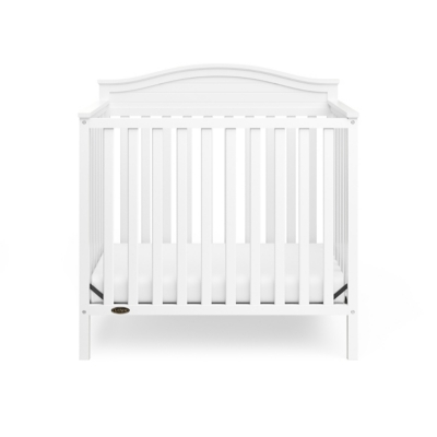 Front view of white Graco Stella 4-in-1 Convertible Mini Crib