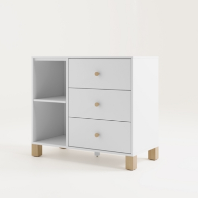 Angled view of white dresser showing right drawers and left open shelves