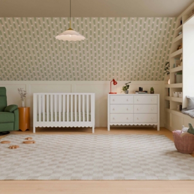 White 6-drawer dresser with red lamp in a child's room