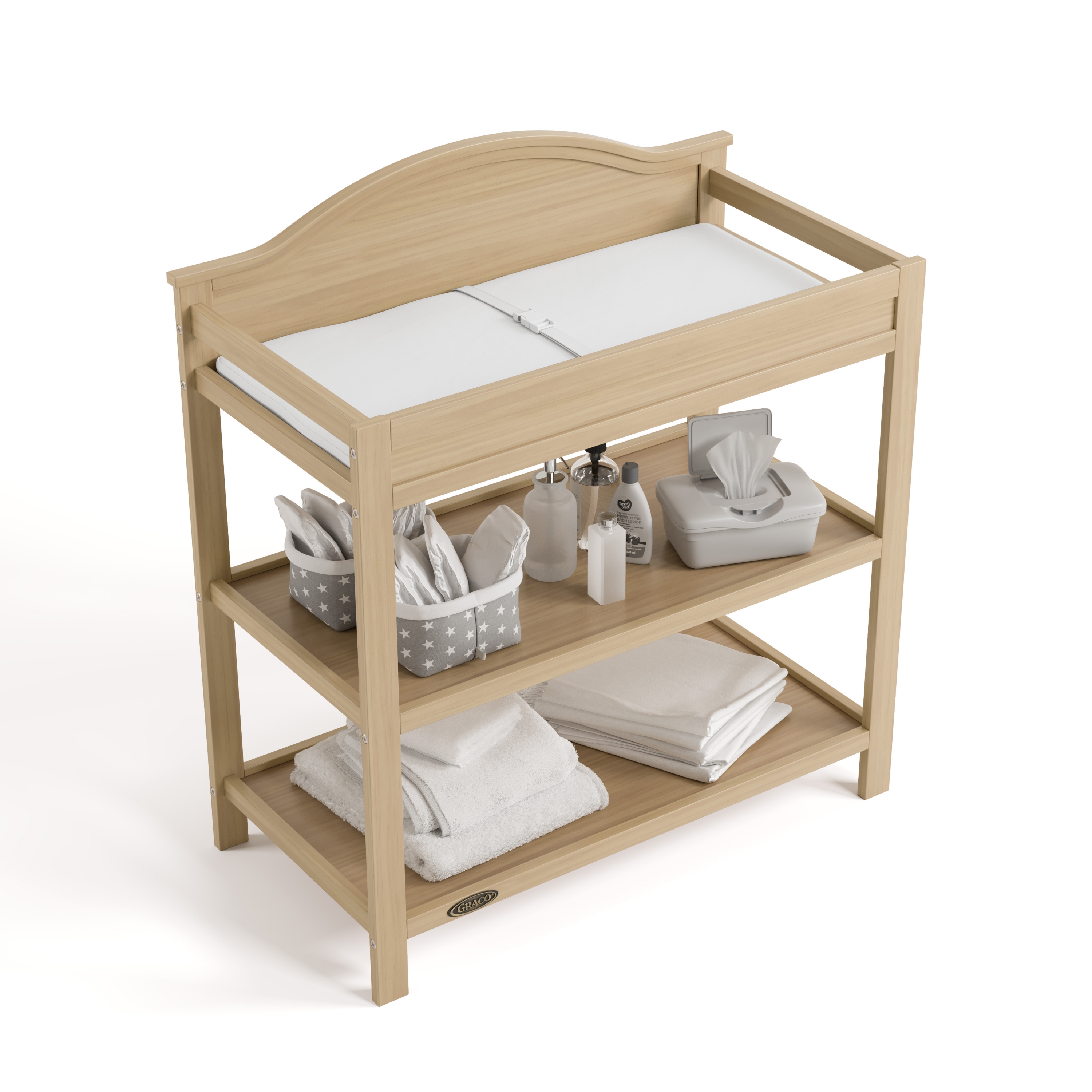 Graco Story Changing Table with towels and accessories.