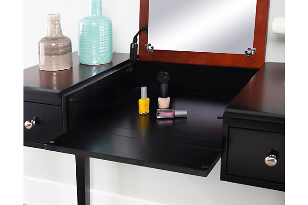 Tight on space, yet need a stylish and functional vanity for a bedroom or dressing area? The Sloan vanity set can easily fit into a small space because it takes up minimal floor space. In a traditional design and style, it offers ample storage and display space. Its two side storage drawers are handy for keeping makeup and accessories organized, while the flip top showcases a mirror and ample interior storage space. In addition to functionality, you'll love its sophisticated style full of classic elements like rich black cherry finish, elegant accented legs and simple lines. A matching stool in cozy upholstery is included.Made of wood, engineered wood, foam and fabric | Black cherry finish | Large flip top mirror | 2 smooth-gliding side drawers | Flip top reveals ample interior storage space | Includes plush padded stool upholstered in beige fabric | Assembly required