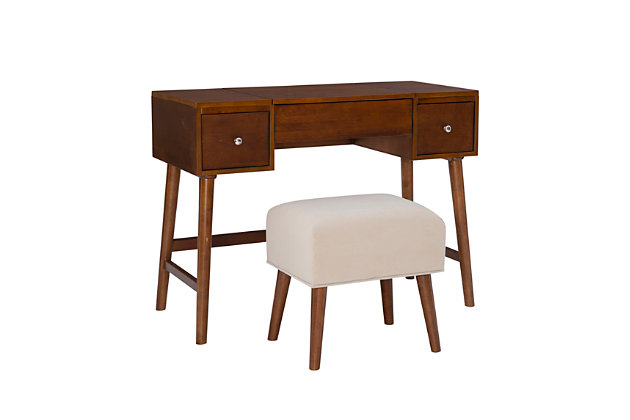 Ready yourself for the day in the versatility and mid-century style of the Maggie vanity set. Its eye-catching style includes a large tabletop, ideal for storing perfume bottles and trinkets, while two drawers provide space to keep small items organized. The flip top mirror opens to reveal additional hidden storage space. The matching stool is plush with a cushioned top upholstered in a neutral patterned fabric. What a find, a vanity that combines the elegance of the past with a design that meets today's needs.Made of rubberwood, wood, engineered wood, birch veneer, foam and fabric | Walnut-colored finish | Flip top mirror | 2 storage drawers | Includes stool with plush cushioned top upholstered in a neutral patterned fabric | Assembly required
