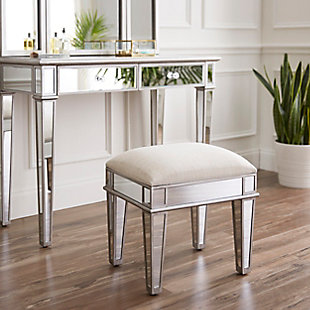 Mirror, mirror on the wall, who’s the most glammed up of all? This vanity desk and bench live out Hollywood glamour every day. Two drawers hold all that makes you red carpet ready and the fully mirrored desktop transforms your space into a backstage dressing room. Get ready for Tinseltown style in your dressing area or open concept living space, because this vanity set makes every morning fabulous.Set includes desk, folding mirror hutch and stool | Made of wood, engineered wood, mirrored glass, felt, foam and velvet | Matte silvertone finish with beveled mirror accents | Beige velvet upholstered seat cushion | 2 drawers with faux crystal pulls | 3-way mirror attaches to desk | Assembly required | Assembly time frame is 15 to 30 min. | Ships in 3 boxes