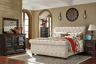 Of great and sophisticated stature, the Willenburg queen upholstered bed is homey and full of substance. Exaggerated rolled tops on the headboard and footboard make a memorable statement. Textural upholstery is elevated with button tufting. Neutral linen color is ready to complement the bedding of your choice. Bun feet add the finishing touch. Mattress and foundation/box spring available, sold separately.Made of wood and engineered wood | Includes headboard, footboard and rails | Tufted headboard and footboard | Polyester upholstery | Assembly required | Foundation/box spring required, sold separately | Mattress available, sold separately | Estimated Assembly Time: 55 Minutes