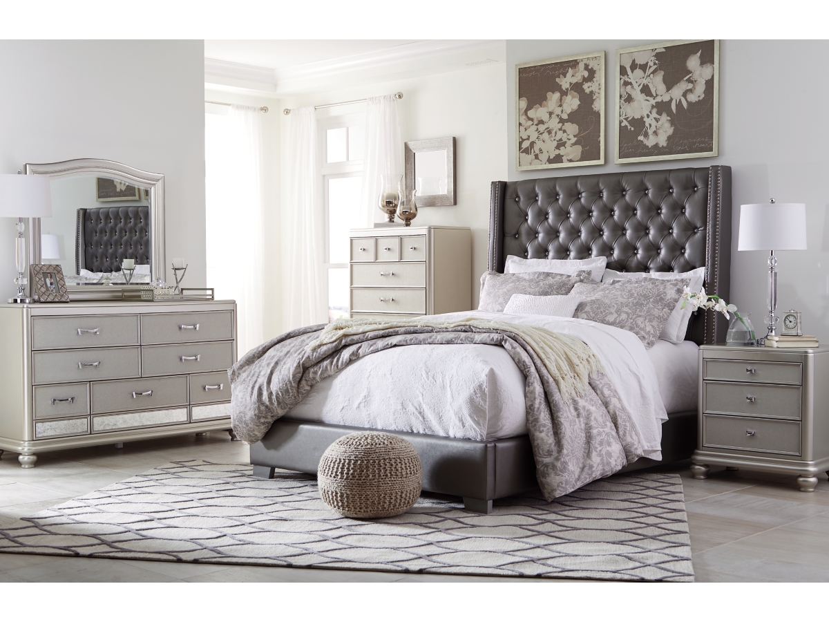 Coralayne Queen Vinyl Upholstered Bed with Faux Diamond Tufting Ashley