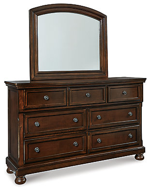 The quality craftsmanship is clear to see. The classic design elements—including inlaid panels, antiqued hardware and bun feet—are easy to love. Satisfying your taste for vintage inspiration, the Porter dresser is elegant without looking fussy. Seven roomy drawers keep your wardrobe organized in style, while a hidden pull-out tray puts your small valuables out of sight. The beveled mirror frame beautifully echoes this dresser’s rustic finish.Made of veneers, wood and engineered wood | Hand-finished | Dark bronze-tone hardware | 7 smooth-operating drawers with dovetail construction | Top drawers with felt bottoms; bottom drawers with cedar bottoms | Pull-out tray behind top middle drawer | Bun feet | Mirror attaches to back of dresser | Assembly required | Includes tipover restraint device | Estimated Assembly Time: 5 Minutes