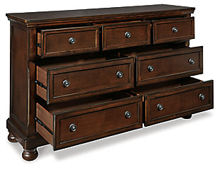The quality craftsmanship is clear to see. The classic design elements—including inlaid panels, antiqued hardware and bun feet—are easy to love. Satisfying your taste for traditional furnishings, the Porter dresser is elegant without looking fussy. Seven roomy drawers keep your wardrobe organized in style. A hidden pull-out tray behind the top middle drawer puts your small valuables out of sight.Dresser only | Made of veneers, wood and engineered wood | Hand-finished | Dark bronze-tone hardware | 7 smooth-operating drawers with dovetail construction | Top drawers with felt bottoms; bottom drawers with cedar bottoms | Pull-out tray behind top middle drawer | Bun feet | Minor assembly required | Includes tipover restraint device