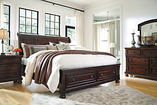 The quality craftsmanship is clear to see. The classic design elements—including bun feet—are easy to love. Satisfying your taste for vintage inspiration, the Porter queen sleigh storage bed is elegant, without looking fussy. Two built-in drawers at the foot of the bed are great for storing linens and throws. Mattress sold separately.Made of veneers, wood and engineered wood | Includes headboard, footboard with storage, cross slats and rails | Hand-finished | Dark bronze-tone hardware | 2 smooth-operating drawers with dovetail construction and cedar bottoms | Footboard with bun feet | Assembly required | Small Space Solution | Bed does not require a foundation/box spring | Mattress available, sold separately | Estimated Assembly Time: 10 Minutes