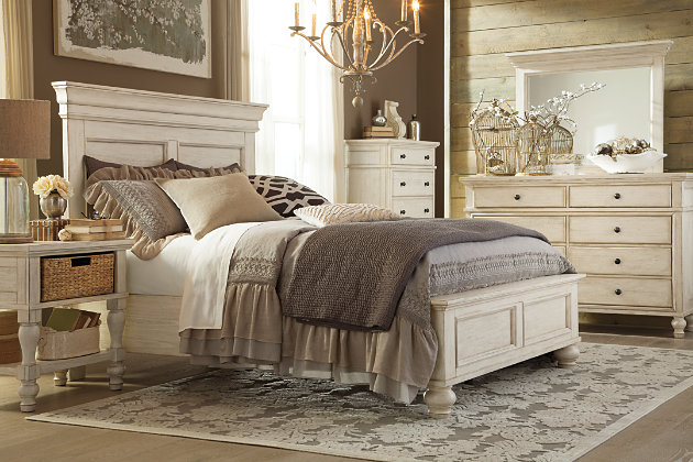 The very essence of cottage chic. Classic paneling and thick moulding give the Marsilona queen panel bed a sculptural look. Textured distressing and a washed finish are vintage inspired and full of lasting appeal. Higher headboard sets the perfect stage for Euro pillows and other oversized pillows. Mattress and foundation/box spring sold separately.Made of wood and veneers | Includes headboard, footboard and rails | Textured washed finish | Classic bun feet | Assembly required | Foundation/box spring required, sold separately | Mattress available, sold separately | Estimated Assembly Time: 70 Minutes