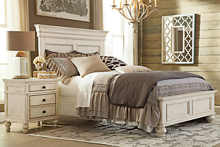 The very essence of cottage chic. Classic paneling and thick moulding give the Marsilona queen panel bed a sculptural look. Textured distressing and a washed finish are vintage inspired and full of lasting appeal. Higher headboard sets the perfect stage for Euro pillows and other oversized pillows. Mattress and foundation/box spring sold separately.Made of wood and veneers | Includes headboard, footboard and rails | Textured washed finish | Classic bun feet | Assembly required | Foundation/box spring required, sold separately | Mattress available, sold separately | Estimated Assembly Time: 70 Minutes