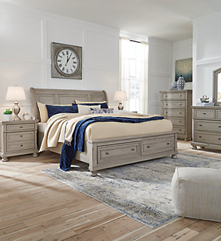 Satisfying your taste for tradition, the Lettner queen sleigh bed with storage sports serene sophistication. Forever classic design details—inlaid panels, silvertone patina hardware and bun feet—are so easy to love. Burnished light gray finish elevates the look with modern sensibility. Two roomy drawers keep your essentials organized in style. Mattress available, sold separately.
Made of veneers, wood and engineered wood | Includes headboard, footboard with storage, slats and rails | Silvertone patina hardware | 2 smooth-gliding drawers with dovetail construction | Mattress available, sold separately | Bed does not require a foundation/box spring | Assembly required | Estimated Assembly Time: 70 Minutes