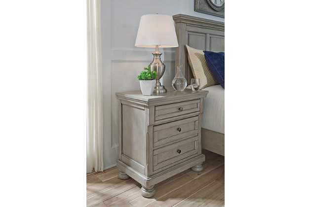 Satisfying your taste for tradition, the Lettner nightstand sports serene sophistication. Forever classic design details—inlaid panels, silvertone patina hardware and bun feet—are so easy to love. Its burnished light gray finish elevates the look with modern sensibility. Two roomy drawers keep bedside odds and ends within easy reach. A hidden pull-out tray behind the bottom drawer puts your small valuables out of sight.Made of veneers, wood and engineered wood | Silvertone patina hardware | 2 smooth-gliding drawers with dovetail construction (pull-out tray and top drawer felt lined) | Small Space Solution | Estimated Assembly Time: 15 Minutes