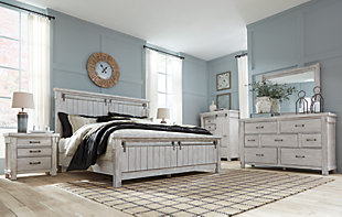 The Brashland chest of drawers brings a fresh twist to the modern farmhouse movement. Handsome, hearty profile is made all the more interesting with a sliding “barn door” revealing shelved storage. Through-tenon styling incorporates a welcome touch of American craftsman. And the easy on the eyes, distressed white finish? Just the tone for a soothing, serene bedroom retreat.Made of veneers, wood and engineered wood | White textured finish | Brushed nickel-tone hardware | 5 smooth-gliding drawers with dovetail construction | Single shelf behind sliding door | Small Space Solution | Includes tipover restraint device