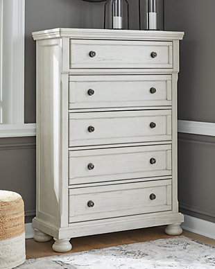 Elegant, timeless furnishings take your bedroom to the next level. Nothing does that better than the Robbinsdale five-drawer chest. The antiqued white finish with a wonderful grain texture oozes sophistication, while the dark bronze-tone hardware adds an ornate touch. A felt-lined top drawer rounds out the piece for the ultimate tasteful bedroom.Made with select oak veneer, engineered wood and solid wood components | Antiqued white finish with grain texture | Dark bronze-toned knobs | 5 smooth-gliding drawers with dovetail construction with metal ball bearing side glides | Upper drawer with felt bottom | Assembly required | Estimated Assembly Time: 15 Minutes