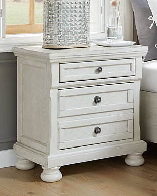 Elegant, timeless furnishings take your bedroom to the next level. Nothing does that better than the Robbinsdale two-drawer nightstand. The antiqued white finish with a wonderful grain texture oozes sophistication, while the dark bronze-tone hardware adds an ornate touch. Felt finishing in the top drawer and a concealed drawer inside the lower drawer round out the piece for the ultimate tasteful bedroom.Made with select oak veneer, engineered wood and solid wood components | Antiqued white finish with grain texture | Dark bronze-toned knobs | 2 smooth-gliding drawers with dovetail construction and ball bearing side glides (pull-out tray and top drawer felt lined) | Assembly required | Estimated Assembly Time: 15 Minutes
