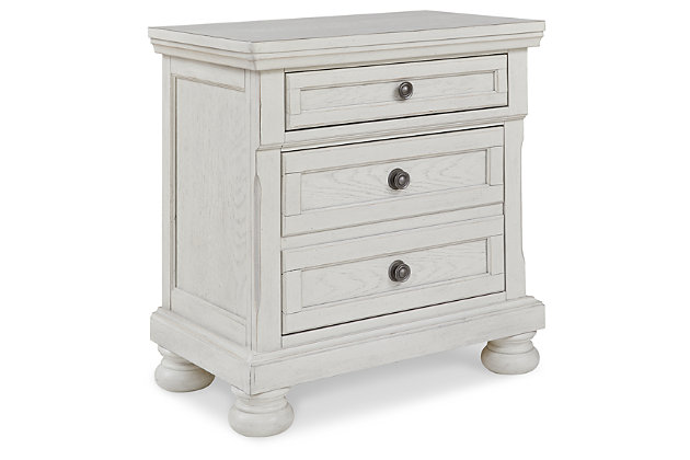Elegant, timeless furnishings take your bedroom to the next level. Nothing does that better than the Robbinsdale two-drawer nightstand. The antiqued white finish with a wonderful grain texture oozes sophistication, while the dark bronze-tone hardware adds an ornate touch. Felt finishing in the top drawer and a concealed drawer inside the lower drawer round out the piece for the ultimate tasteful bedroom.Made with select oak veneer, engineered wood and solid wood components | Antiqued white finish with grain texture | Dark bronze-toned knobs | 2 smooth-gliding drawers with dovetail construction and ball bearing side glides (pull-out tray and top drawer felt lined) | Assembly required | Estimated Assembly Time: 15 Minutes