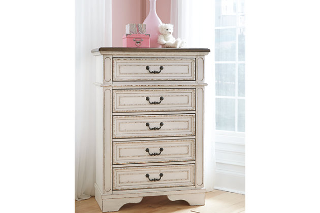 Elevating the art of traditional cottage styling, the Realyn chest of drawers is your dream bedroom retreat realized. Antiqued two-tone aesthetic blends a chipped white with a distressed wood finished top for added charm. Framed drawer fronts and decorative corbels add refinement, while bail pulls in a dark bronze-tone finish lend a classic touch.Made of veneers, wood and engineered wood, with cast resin components | Antiqued two-tone finish | 5 smooth-gliding drawers with dovetail construction (top drawer felt lined) | Dark bronze-tone hardware | Estimated Assembly Time: 15 Minutes