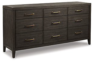 Few pieces demand attention like the Bellvern dresser. Those drawn to the earthy character of the wire-brushed texture—with a complex, multi-layered finish—can appreciate the beauty and craftsmanship of this bedroom essential. In addition to its acacia wood and oak veneer construction, clean contemporary lines and simple symmetry have a minimalist appeal that fits perfectly in an upscale transitional setting.Dresser only | Made of acacia wood, oak veneer and engineered wood | Blackened effect finish with contrasting gray undertones and wire-brushed texture | Antiqued bronze-tone hardware | 9 smooth-gliding drawers with dovetail construction | Top drawers felt-lined | Assembly required | Estimated Assembly Time: 30 Minutes