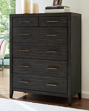 Few pieces demand attention like the Bellvern chest of drawers. Those drawn to the earthy character of the wire-brushed texture—with a complex, multi-layered finish—can appreciate the beauty and craftsmanship of this bedroom essential. In addition to its acacia wood and oak veneer construction, clean contemporary lines and simple symmetry have a minimalist appeal that fits perfectly in an upscale transitional setting.Made of acacia wood, oak veneer and engineered wood | Blackened effect finish with contrasting gray undertones and wire-brushed texture | Antiqued bronze-tone hardware | 6 smooth-gliding drawers with dovetail construction | Top drawers felt-lined | Assembly required | Estimated Assembly Time: 30 Minutes